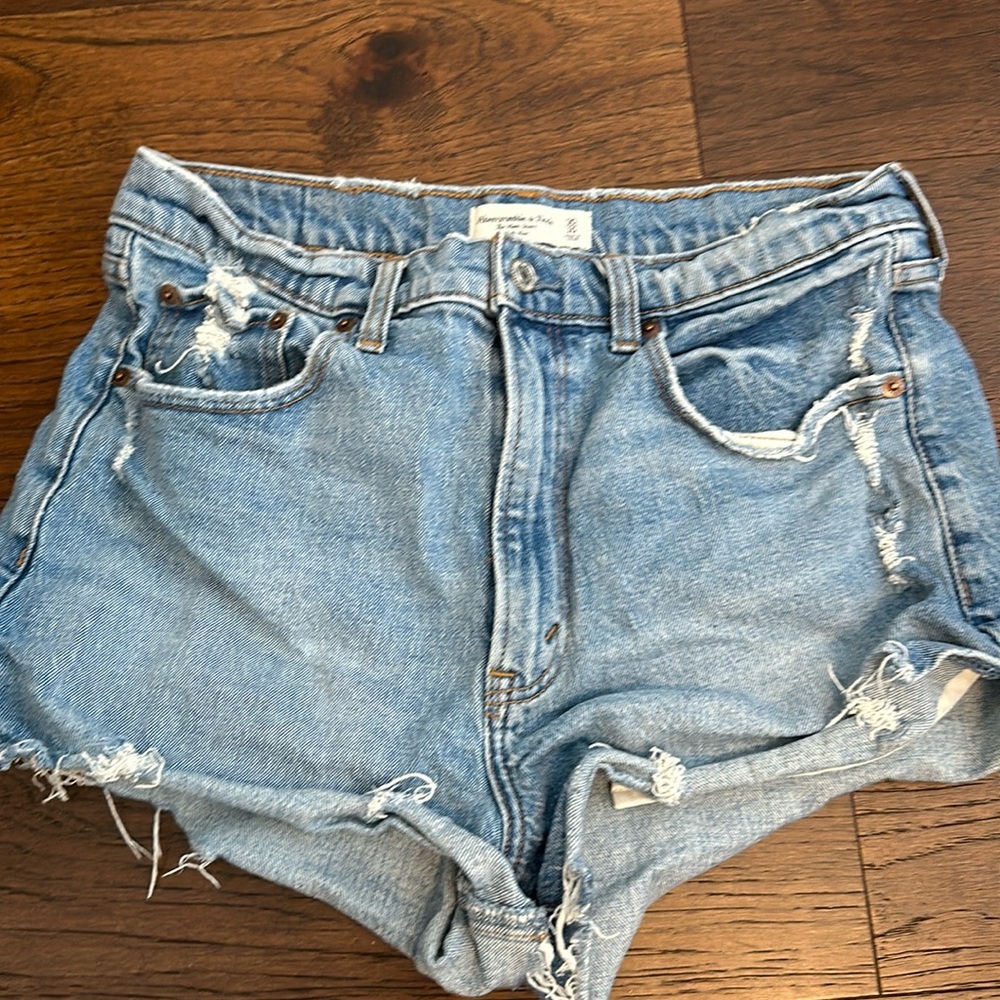Medium wash Abercrombie Jean shorts. High rise/tighter fit